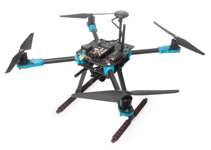 Quadcopter drone with visible electronics on a white background
